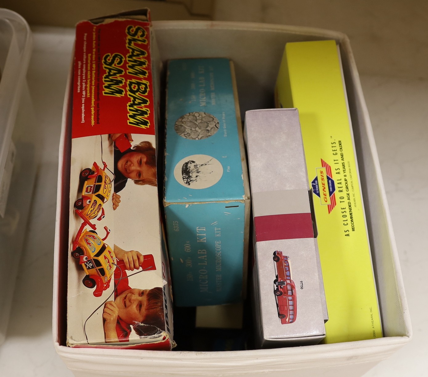An assortment of miscellaneous boxed toys, two dolls etc